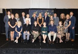 honorees and board of education members pose for picture on event stage
