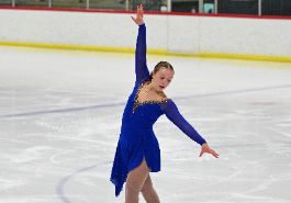  Brooklynn Twok ice skating in blue costume