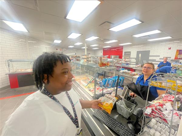 Individual in bright cafeteria line